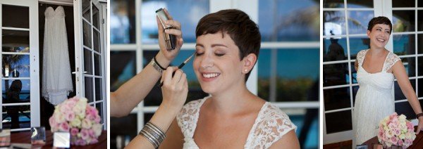 Final touches of make up applied to Bride, with wedding dress and bouquet details seen